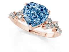 Fancy Blue Heart Cut Diamond Ring Set in Rose gold with Scattered Round Accents