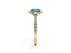 Fancy Blue Radiant Cut Diamond Solitaire Ring Set in Yellow gold with Pavé Band and Floral Prong Setting