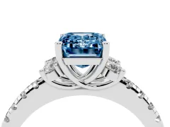 Fancy Blue Emerald Cut Diamond Three-Stone Pavé Ring Set in Platinum with Prong Setting