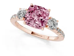 Fancy Pink Cushion Cut Diamond Three-Stone Ring Set in Rose gold with Pavé Band and Graduated Sides