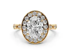 Oval Cut Diamond Halo Engagement Ring Set in Yellow gold with Twisted Band and Prong Setting