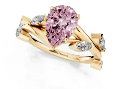 Fancy Pink Pear Cut Diamond Solitaire Ring Set in Yellow gold with Twisted Marquise Accent Band
