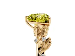Fancy Yellow Heart Cut Diamond Solitaire Ring Set in Yellow gold with Leaf Motif Band