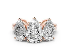 Pear Cut Diamond Three-Stone Ring Set in Rose gold with Channel-Set Band and Prong Settings
