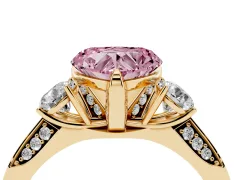 Fancy Pink Heart Cut Diamond Three-Stone Ring Set in Yellow gold with Pavé Band and Smaller Side Stones