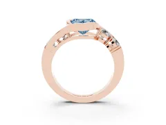 Fancy Blue Heart Cut Diamond Bezel Bypass Ring Set in Rose gold with Round Accents