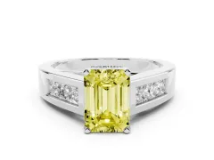 Fancy Yellow Emerald Cut Diamond Solitaire Ring Set in White gold with Channel-Set Accent Stones and Prong Setting