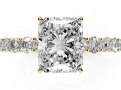 Radiant Cut Diamond Solitaire Ring Set in Yellow gold with Shared Prong Pavé Band