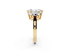 Marquise Cut Diamond Three-Stone Ring Set in Yellow gold with Channel-Set Band and Prong Settings