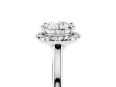 Oval Cut Diamond Halo Engagement Ring Set in White gold with Pavé Band and Rising Shoulders