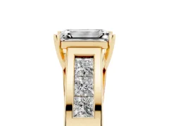 Emerald Cut Diamond Solitaire Ring Set in Yellow gold with Channel-Set Accent Stones and Prong Setting