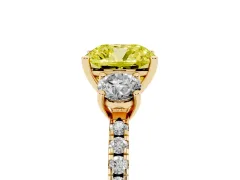 Fancy Yellow Cushion Cut Diamond Three-Stone Ring Set in Yellow gold with Pavé Band and Graduated Sides