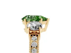 Fancy Green Pear Cut Diamond Three-Stone Ring Set in Yellow gold with Round Side Stones and Pavé Band
