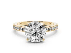 Round Cut Diamond Pavé Solitaire Ring Set in Yellow gold with Round Band Accents and Prong Setting
