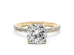 Cushion Cut Diamond Solitaire Engagement Ring Set in Yellow gold with Round Pavé Band and Prong Setting