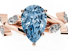 Fancy Blue Pear Cut Diamond Solitaire Ring Set in Rose gold with Twisted Marquise Accent Band