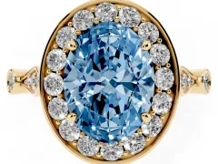 Fancy Blue Oval Cut Diamond Halo Engagement Ring Set in Yellow gold with Twisted Band and Prong Setting