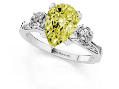Fancy Yellow Pear Cut Diamond Three-Stone Ring Set in Platinum with Pavé Band and Smaller Side Stones