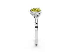 Fancy Yellow Heart Cut Diamond Three-Stone Ring Set in Platinum with Pavé Band and Smaller Side Stones