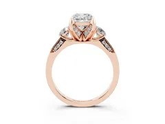 Cushion Cut Diamond Three-Stone Ring Set in Rose gold with Pavé Band and Smaller Side Stones