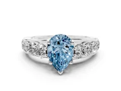 Fancy Blue Pear Cut Diamond Pavé Engagement Ring Set in White gold with Prong Setting