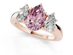 Fancy Pink Pear Cut Diamond Three-Stone Ring Set in Rose gold with Bold Center and Classic Band