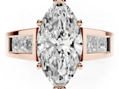 Marquise Cut Diamond Solitaire Ring Set in Rose gold with Channel-Set Accent Stones and Prong Setting