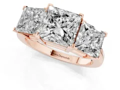 Princess Cut Diamond Three-Stone Ring Set in Rose gold with Channel-Set Band and Prong Settings