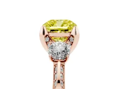 Fancy Yellow Cushion Cut Diamond Three-Stone Ring Set in Rose gold with Pavé Band and Smaller Side Stones