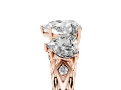Heart Cut Diamond Three-Stone Ring Set in Rose gold with Braided Band
