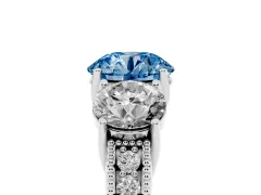 Fancy Blue Round Cut Diamond Three-Stone Engagement Ring Set in Silver with Milgrain Pavé Band