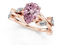 Fancy Pink Pear Cut Diamond Solitaire Ring Set in Rose gold with Twisted Marquise Accent Band