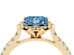 Fancy Blue Princess Cut Diamond Solitaire Ring Set in Yellow gold with Pavé Band and Floral Prong Setting