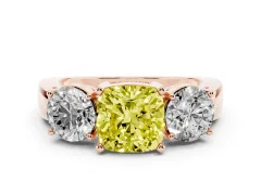 Fancy Yellow Cushion Cut Diamond Three-Stone Ring Set in Rose gold with Round Side Stones and Classic Band