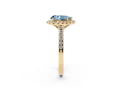 Fancy Blue Pear Cut Diamond Pavé Halo Engagement Ring Set in Yellow gold with Pavé Band and Prong Setting