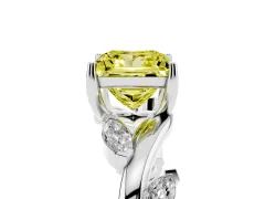 Fancy Yellow Princess Cut Diamond Solitaire Ring Set in Platinum with Twisted Marquise Accent Band