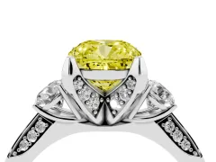 Fancy Yellow Cushion Cut Diamond Three-Stone Ring Set in Platinum with Pavé Band and Smaller Side Stones