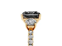 Fancy Black Asscher Cut Diamond Three-Stone Ring Set in Yellow gold with Pavé Band and Graduated Sides