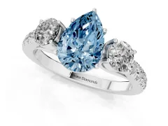 Fancy Blue Pear Cut Diamond Three-Stone Ring Set in Silver with Round Side Stones and Delicate Pavé Band
