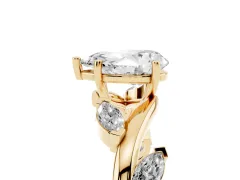 Pear Cut Diamond Solitaire Ring Set in Yellow gold with Twisted Marquise Accent Band