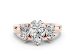Pear Cut Diamond Three-Stone Ring Set in Rose gold with Bold Center and Classic Band