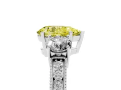 Fancy Yellow Pear Cut Diamond Three-Stone Ring Set in White gold with Round Side Stones and Pavé Band