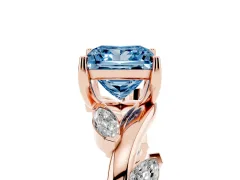 Fancy Blue Princess Cut Diamond Solitaire Ring Set in Rose gold with Twisted Marquise Accent Band