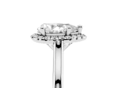 Pear Cut Diamond Halo Engagement Ring Set in White gold with Pavé Band and Rising Shoulders