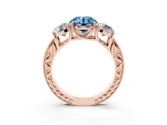 Fancy Blue Round Cut Diamond Three-Stone Engagement Ring Set in Rose gold with Milgrain Pavé Band