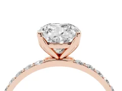 Cushion Cut Diamond Solitaire Engagement Ring Set in Rose gold with Round Pavé Band and Prong Setting