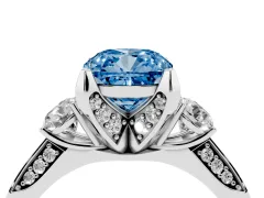Fancy Blue Cushion Cut Diamond Three-Stone Ring Set in Platinum with Pavé Band and Smaller Side Stones