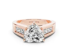 Heart Cut Diamond Solitaire Ring Set in Rose gold with Channel-Set Accent Stones and Prong Setting