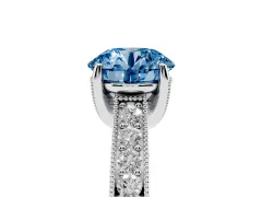 Fancy Blue Round Cut Diamond Solitaire Ring Set in Silver with Milgrain-Edged Pavé Band and Prong Setting
