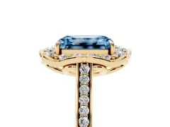 Fancy Blue Emerald Cut Diamond Halo Ring Set in Yellow gold with Pavé-Lined Shoulders and Prong Setting
